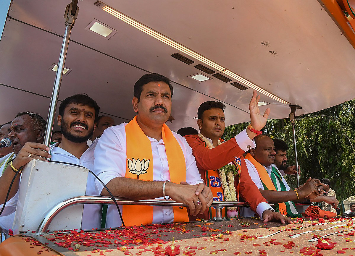 PTI : BJP candidate Yaduveer KC Wadiyar from Mysuru constituency with Karnataka BJP Chief B Y Vijayendra and JD(S) chief HD Kumaraswamy during a roadshow ahead of Lok Sabha polls, in Mysuru