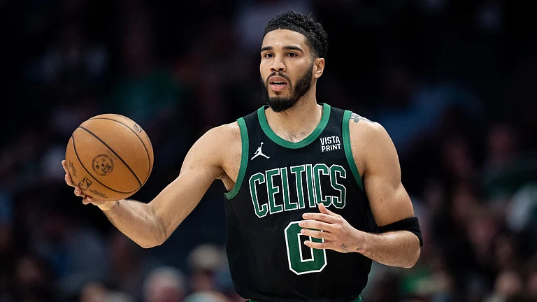 Jayson Tatum #0 of the Boston Celtics brings the ball up court in the third quarter during their game against the Charlotte Hornets at Spectrum Center on April 01, 2024. - File