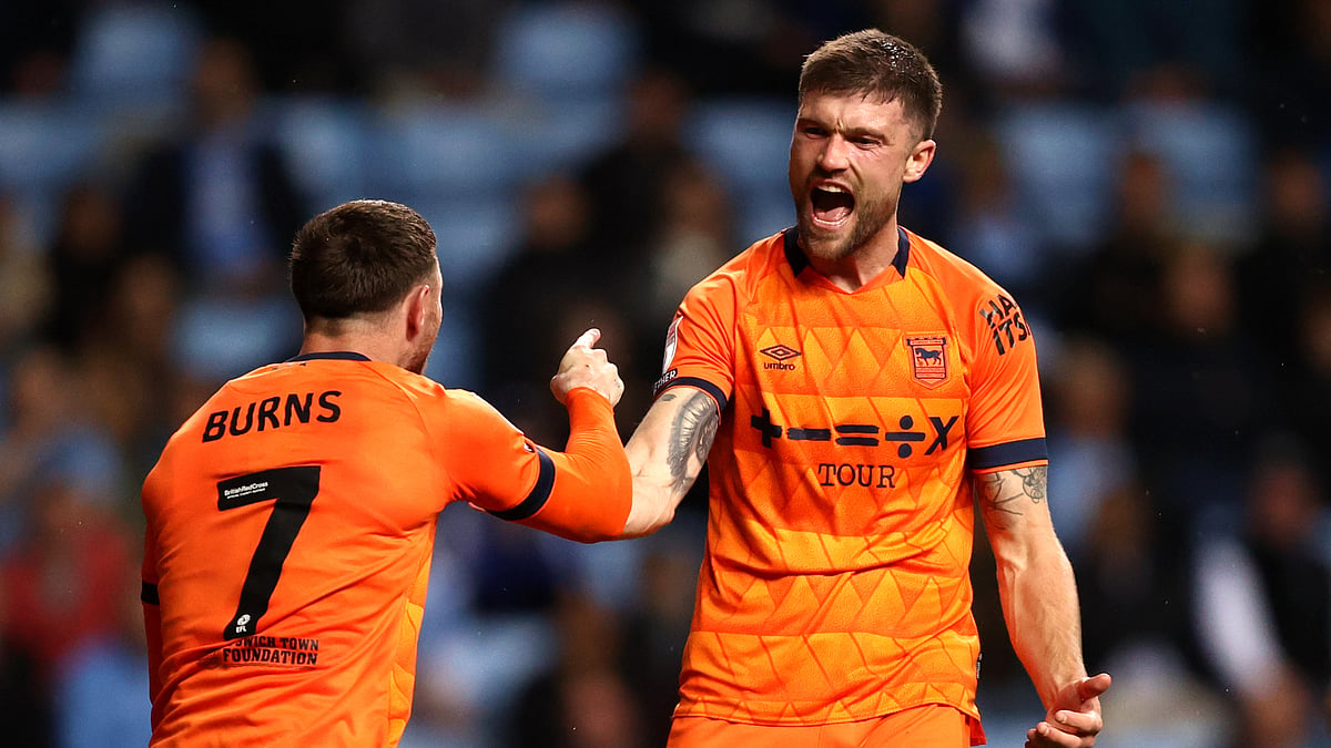 Cameron Burgess (right) celebrates his winner against Coventry City on Tuesday with Wes Burns. - null