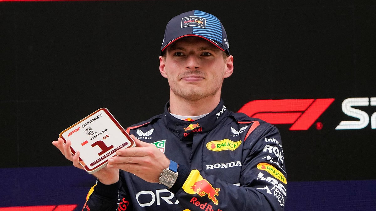 Andy Wong/AP : Red Bull driver Max Verstappen of the Netherlands reacts after winning the sprint race at the Chinese Formula One Grand Prix at the Shanghai International Circuit.