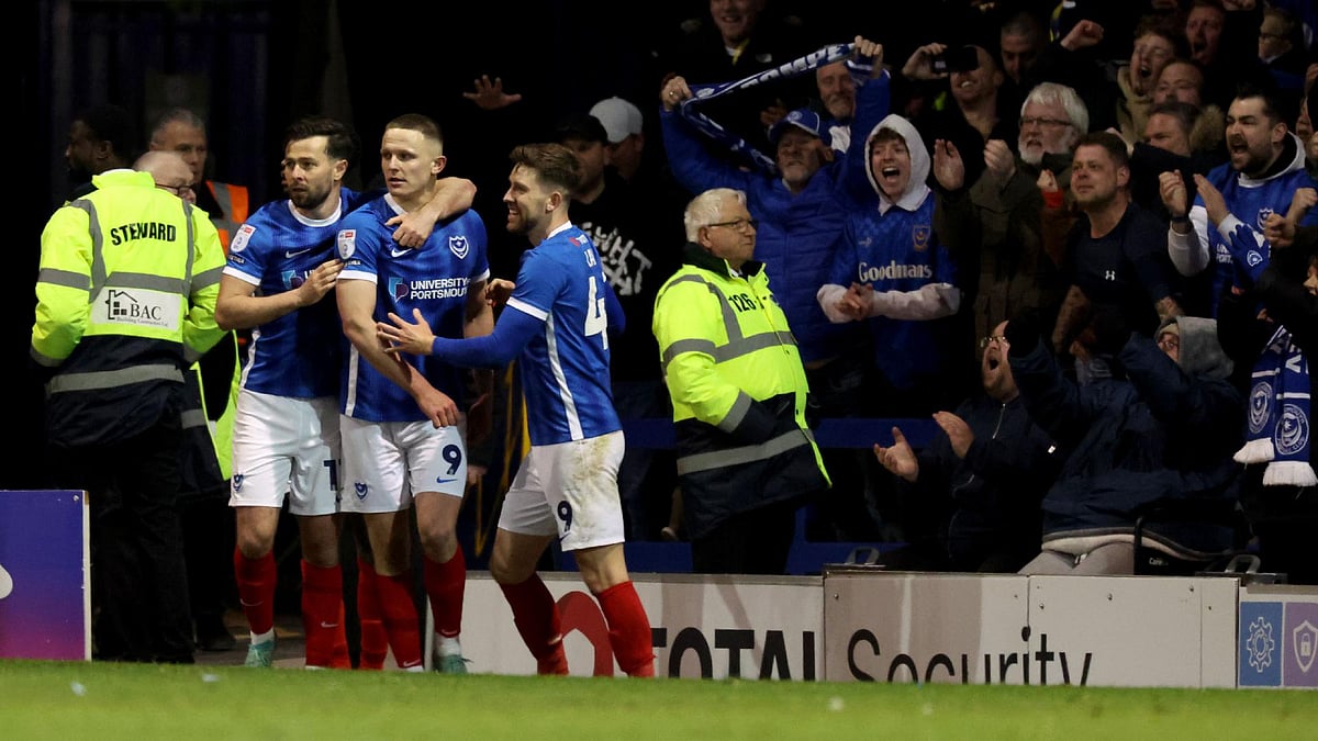 Steven Paston/PA : Portsmouth players celebrate a goal during their League One match against Barnsley. 