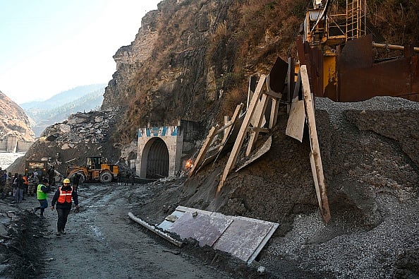 Getty Images : Rescue teams at the entrance of Tapovan tunnel during rescue efforts in Chamoli district on February 11, 2021.
