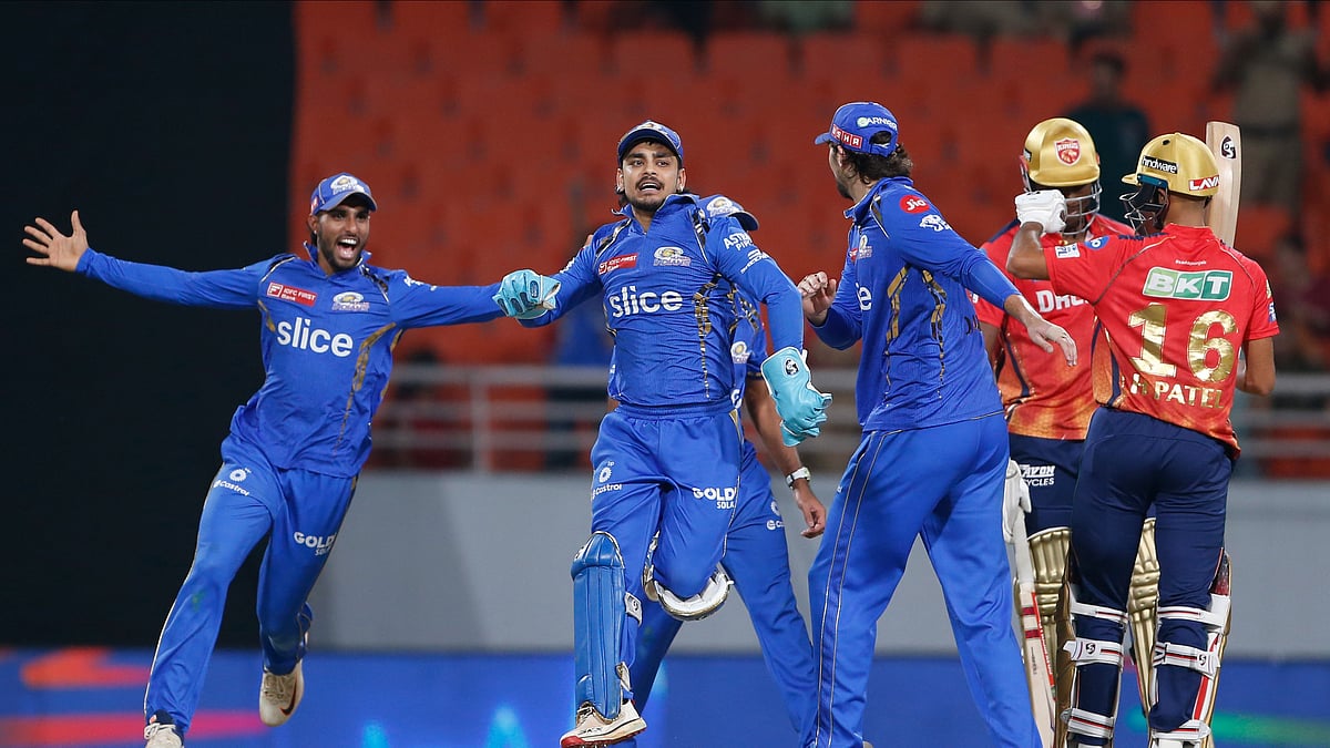 AP Photo/ Surjeet Yadav : Mumbai Indians players celebrate their win against Punjab Kings' during the Indian Premier League cricket match between Punjab Kings' and Mumbai Indians in Mullanpur.