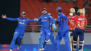 AP Photo/ Surjeet Yadav : Mumbai Indians players celebrate their win against Punjab Kings' during the Indian Premier League cricket match between Punjab Kings' and Mumbai Indians in Mullanpur.