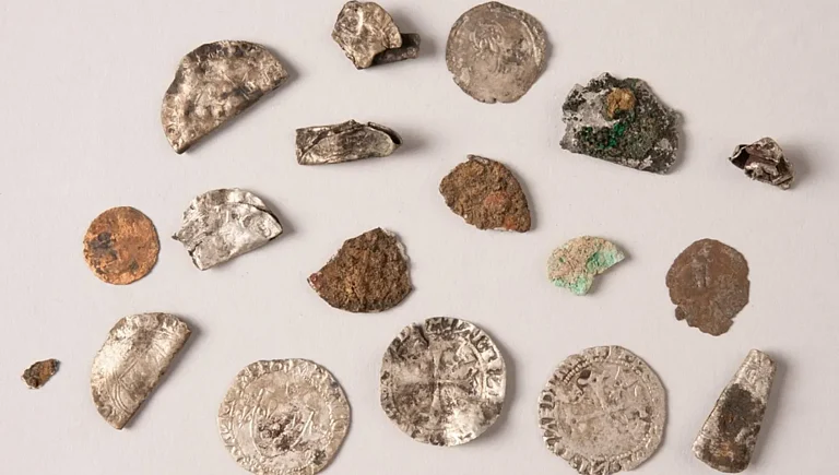 A variety of medieval coins were discovered at the excavation site. - Emmanuelle Collado / National Institute for Preventive Archaeological Research