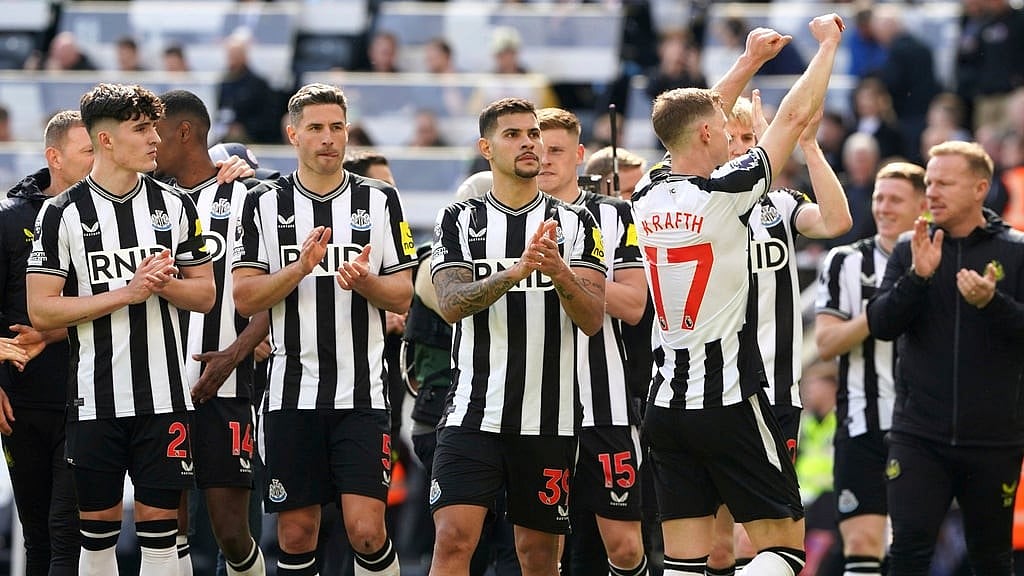 Newcastle United's Emil Krafth, right, celebrates after the English Premier League soccer match between Newcastle United and Tottenham Hotspur at St. James' Park in Newcastle, England, Saturday, April 13, 2024. 

 - (Owen Humphreys/PA via AP)
