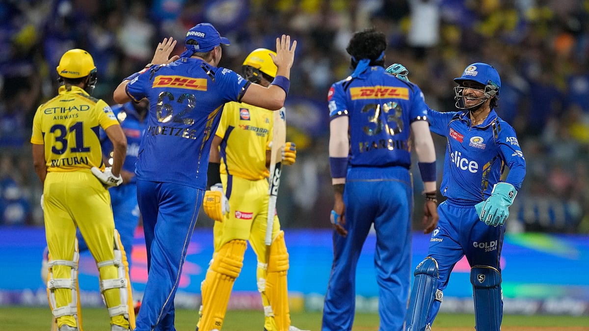 Mumbai Indians' Ishan Kishan, right, celebrates the dismissal of Chennai Super Kings' Rachin Ravindra during the Indian Premier League cricket match between Mumbai Indians and Chennai Super Kings in Mumbai. - AP Photo/ Rafiq Maqbool