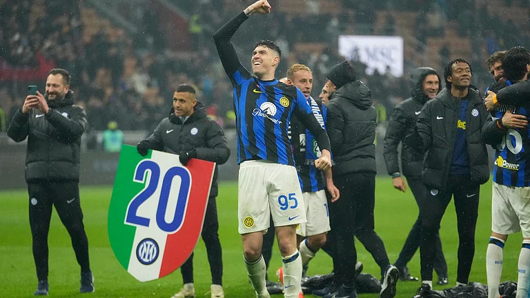 Inter Milan players celebrate after winning their 20th Serie A title with a 2-1 win over AC Milan. - Luca Bruno/AP