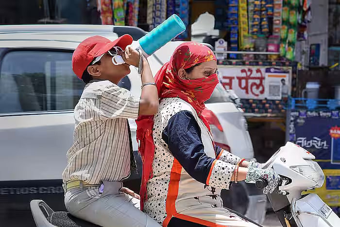 Commuters on road amid scorching heatwaves across several parts of the country 
  - PTI