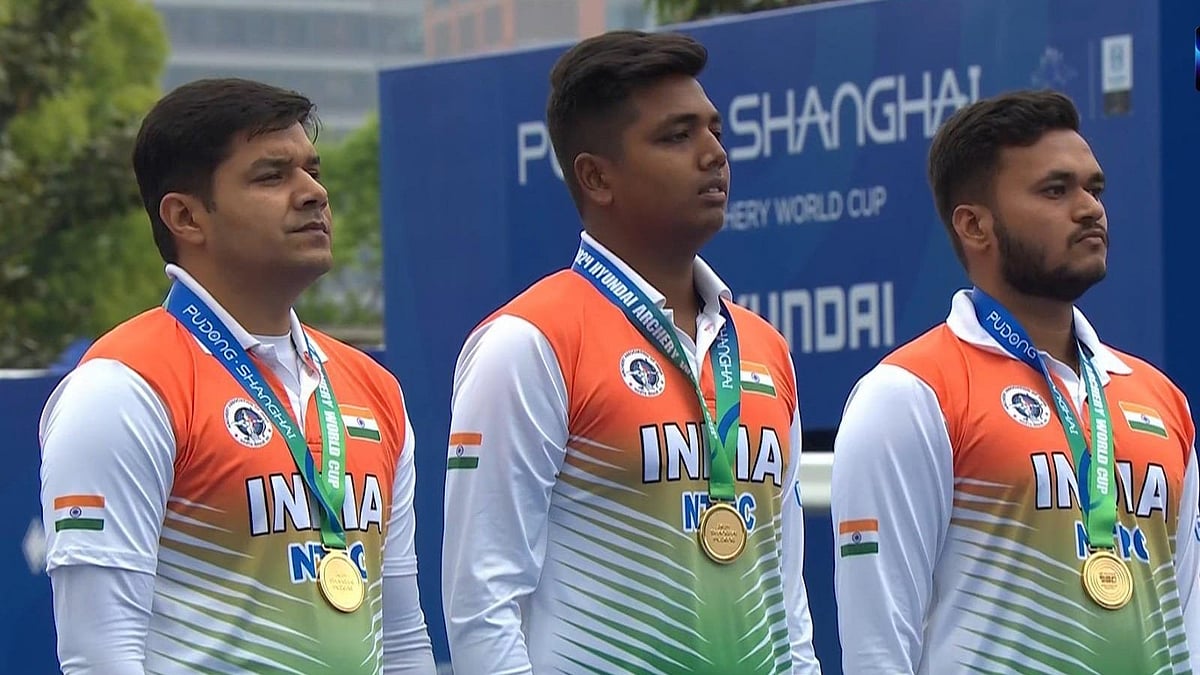 X/SAI Media : India's gold-winning compound men's trio of (left to right) Abhishek Verma, Priyansh and Prathamesh Fuge stands atop the podium at the medal ceremony of Archery World Cup Stage 1 in Shanghai.