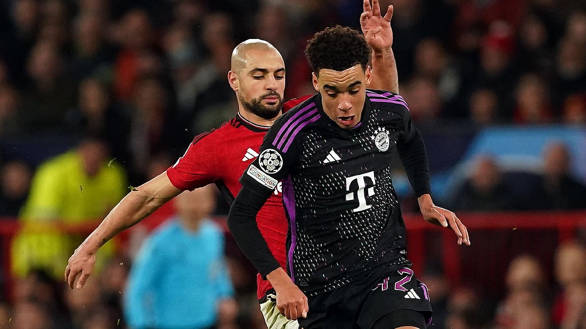 
Manchester United’s Sofyan Amrabat (left) tackles Bayern Munich’s Jamal Musiala. - Martin Rickett, PA