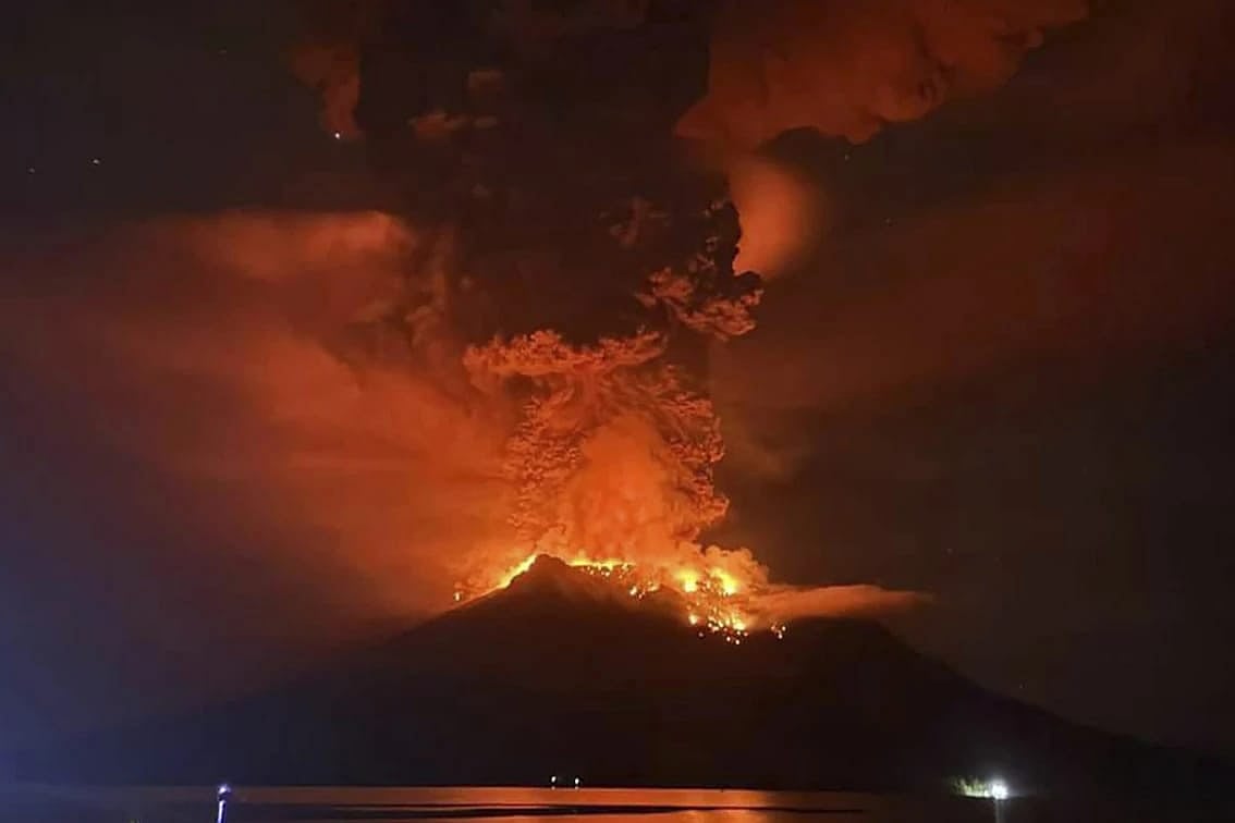 Hot molten lava radiates at the crater of Mount Ruang - AP