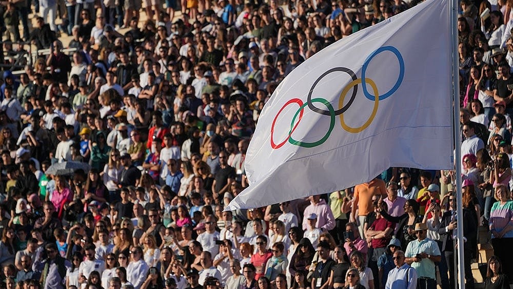 Photo: AP/Petros Giannakouris : Paris 2024 Olympic Flame