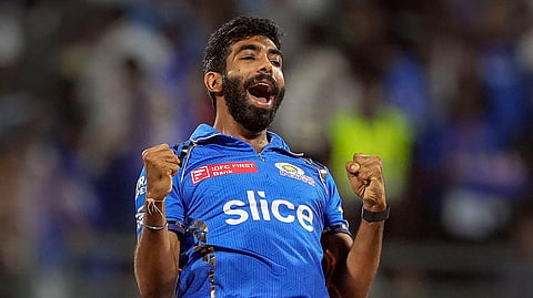 Mumbai Indians bowler Jasprit Bumrah celebrates the wicket of Royal Challengers Bengaluru batter Virat Kohli during their IPL 2024 cricket match at Wankhede Stadium in Mumbai on April 11, 2024.