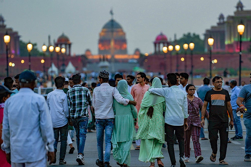 Photo: PTI/Kamal Singh : Visitors at India Gate