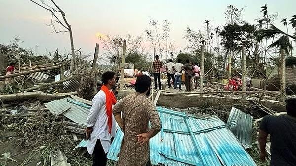 PTI Photo : Houses are damaged and electric poles fell after a heavy storm that left at least five people dead, in Jalpaiguri, West Bengal, March 31, 2024.