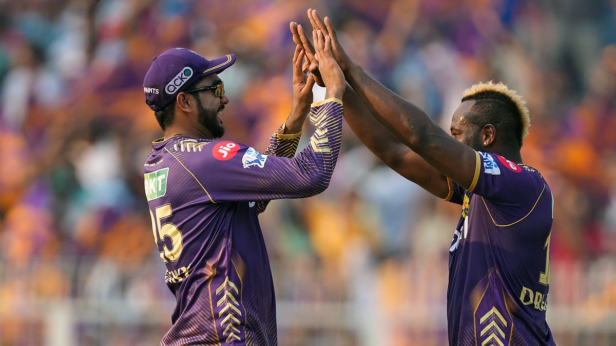 Kolkata Knight Riders' Andre Russell, right, and teammate Varun Chakaravarthy celebrate the wicket of Lucknow Super Giants' captain KL Rahul during the Indian Premier League cricket match between Kolkata Knight Riders and Lucknow Super Giants in Kolkata. - AP Photo/Bikas Das