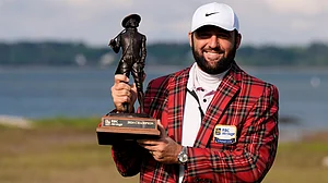 Chris Carlson/AP : Scottie Scheffler holds the trophy after winning the RBC Heritage for his fourth win in five starts.
