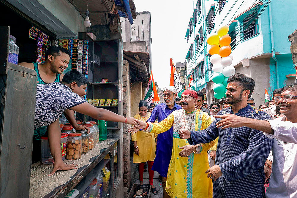 TMC candidate Prasun Banerjee campaigns