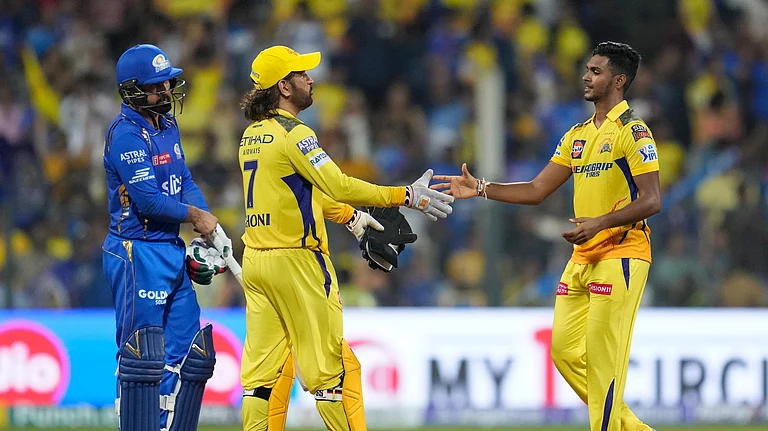 Chennai Super Kings' Matheesha Pathirana, right, along with Chennai Super Kings' MS Dhoni celebrate after their win in the Indian Premier League cricket match against Mumbai Indians in Mumbai. - AP Photo/ Rafiq Maqbool