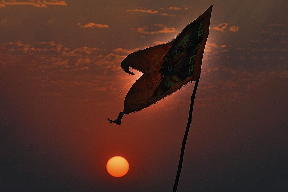 Change in the Air: An Angry Hanuman flag fluttering at Dashashwamedh Ghat in Varanasi - Photo: Tribhuvan Tiwari
