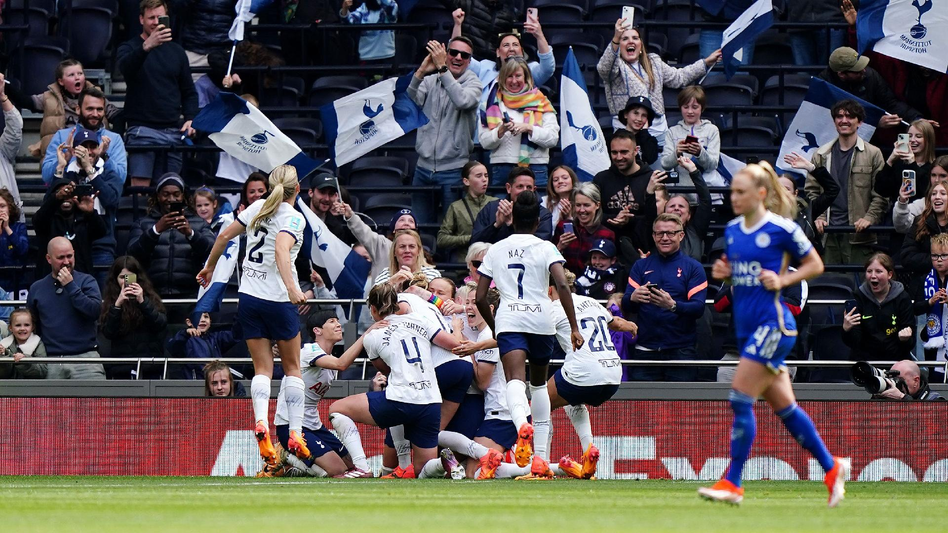 Martha Thomas is bundled by her Tottenham team-mates after her goal beat Leicester to send them through to the Women’s FA Cup final. - Zac Goodwin/PA