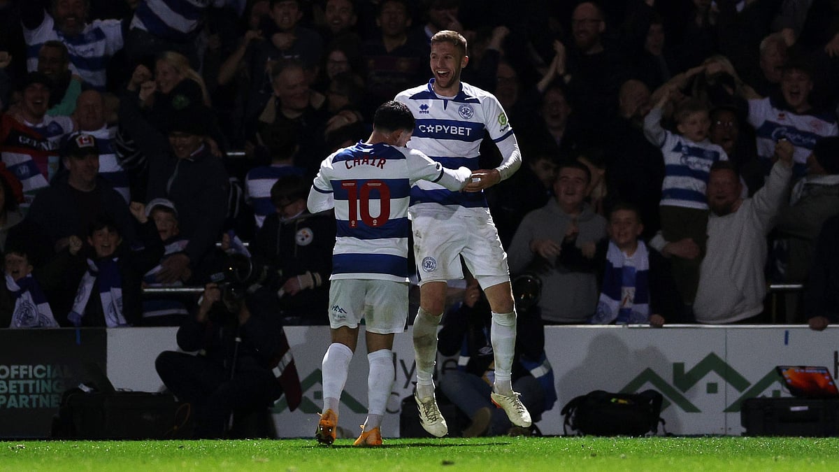 Ilias Chair and Sam Field celebrate a goal. - null
