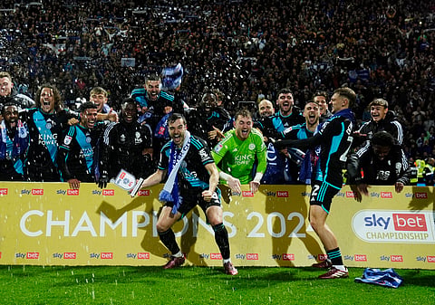Leicester City players celebrate after securing the EFL Championship title after beating Preston North End at Deepdale, Preston.
