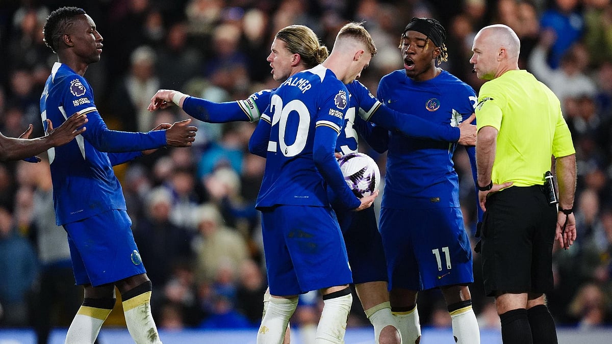 John Walton/PA : Chelsea’s Cole Palmer holds onto the ball as team-mates Nicolas Jackson and Noni Madueke argue.