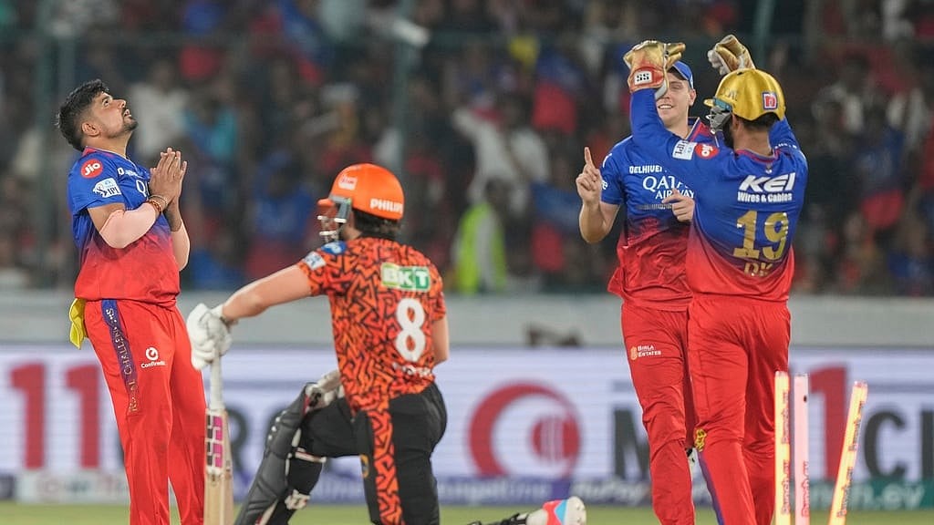 AP : Royal Challengers Bengaluru's Karn Sharma, left, celebrates the wicket of Sunrisers Hyderabad's Nitish Kumar Reddy, centre, during match 41 of Indian Premier League 2024 in Hyderabad on April 25.