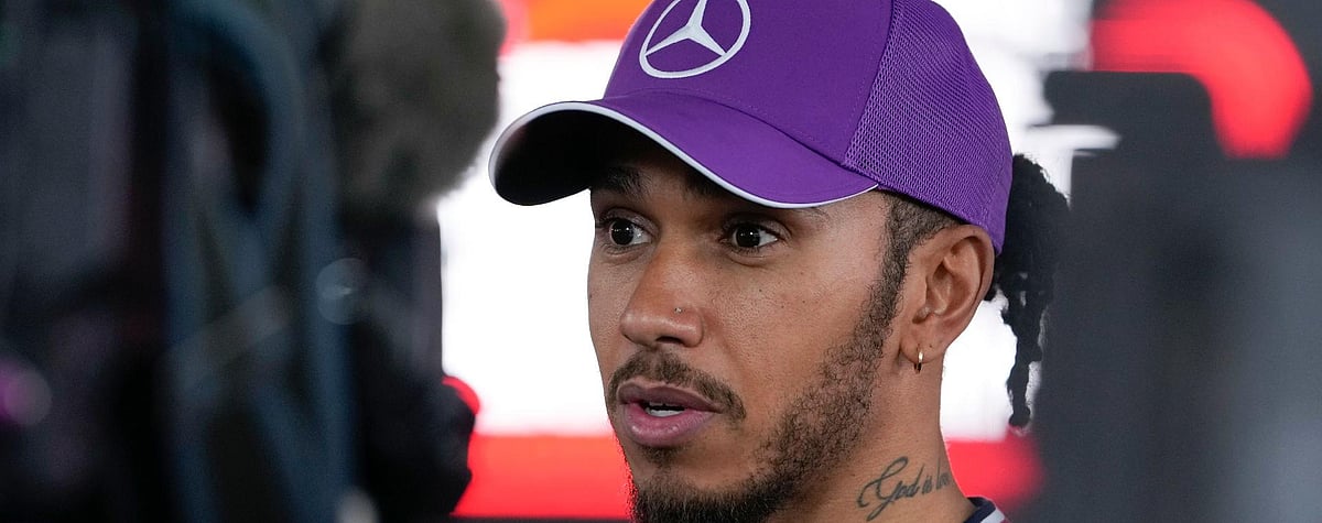 AP/Hiro Komae : Mercedes driver Lewis Hamilton talks to reporters after qualifying