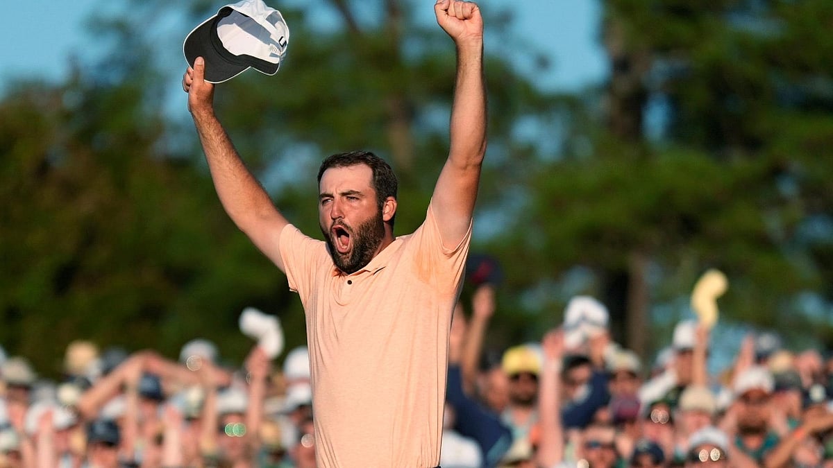 Scottie Scheffler celebrates his win at the Masters golf tournament at Augusta National Golf Club. - Ashley Landis/AP