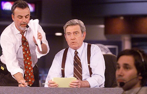 CBS News anchor Dan Rather reads from cue cards during a dress rehearsal of CBS News' election night 2000 coverage Friday, Nov. 3, 2000, in New York.
