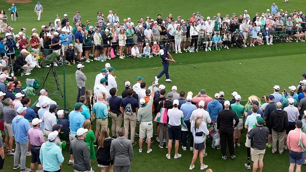 AP : Scottie Scheffler tees off on the eighth hole during a practice round in preparation for the Masters golf tournament at Augusta National Golf Club.