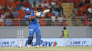 AP Photo/ Surjeet Yadav : Mumbai Indians' Rohit Sharma plays a shot during the Indian Premier League cricket match between Punjab Kings' and Mumbai Indians in Mullanpur.