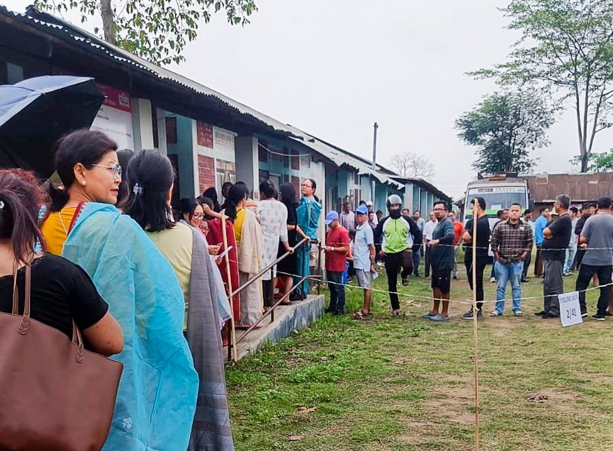 People wait to cast their votes for Lok Sabha elections, in Manipur |