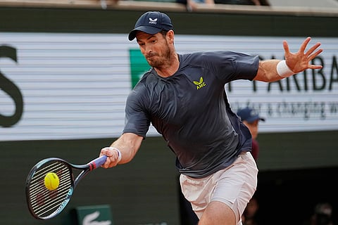Andy Murray plays a shot against Stan Wawrinka