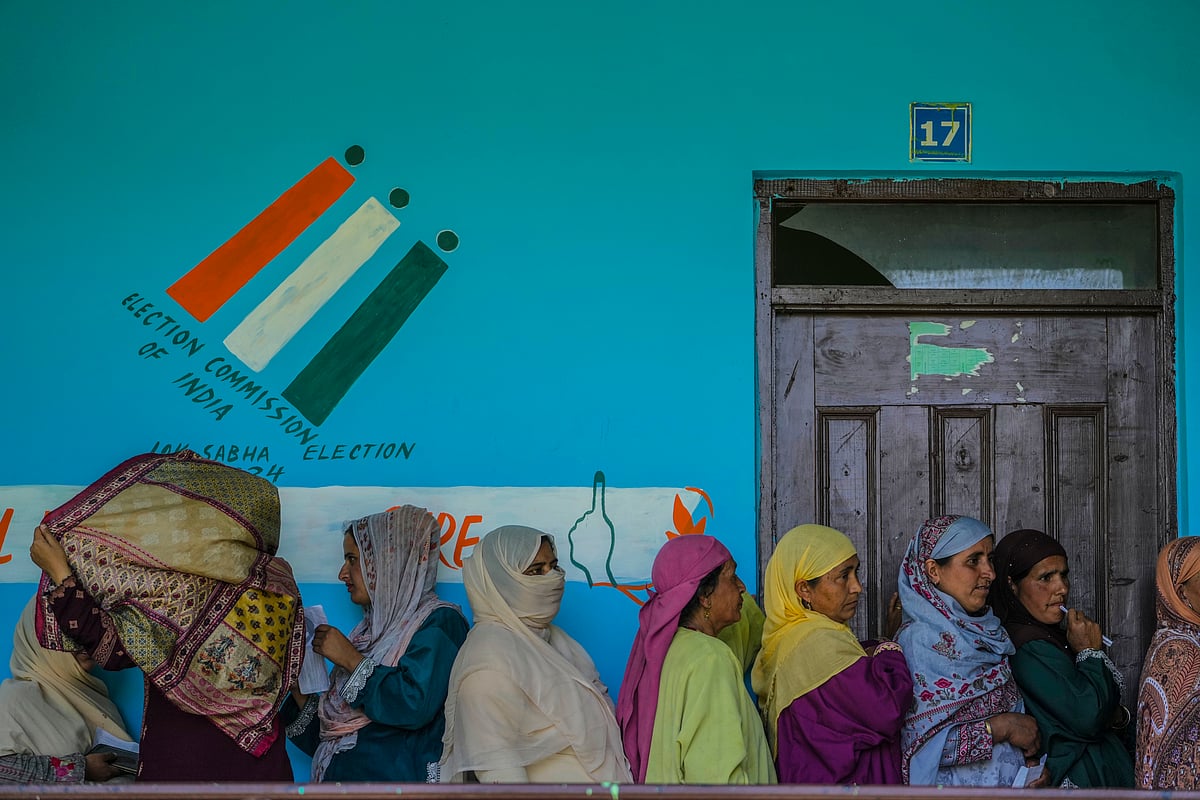 AP : People stand in queue to cast their votes outside a polling booth during the fifth round of multi-phase national elections Sumbal north of Srinagar, Indian controlled Kashmir, Monday, May 20, 2024