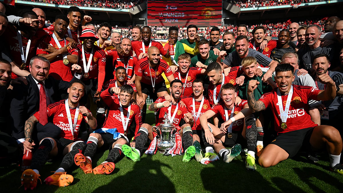 Photo: X/Emirates FA Cup : Triumphant Manchester United players pose with the FA Cup 2023-24 trophy after beating Manchester City in the final on Saturday (May 25, 2024).