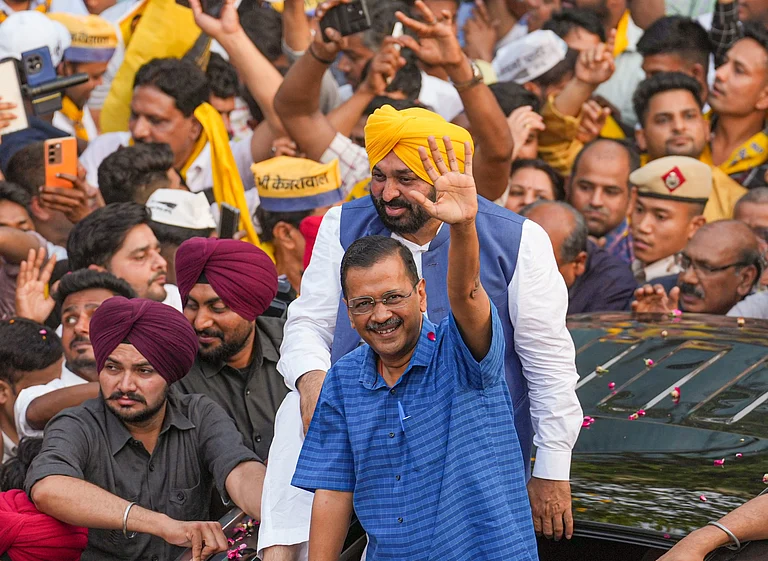 Delhi CM Arvind Kejriwal and Punjab CM Bhagwant Mann hold roadshow in Delhi's Mehrauli - PTI