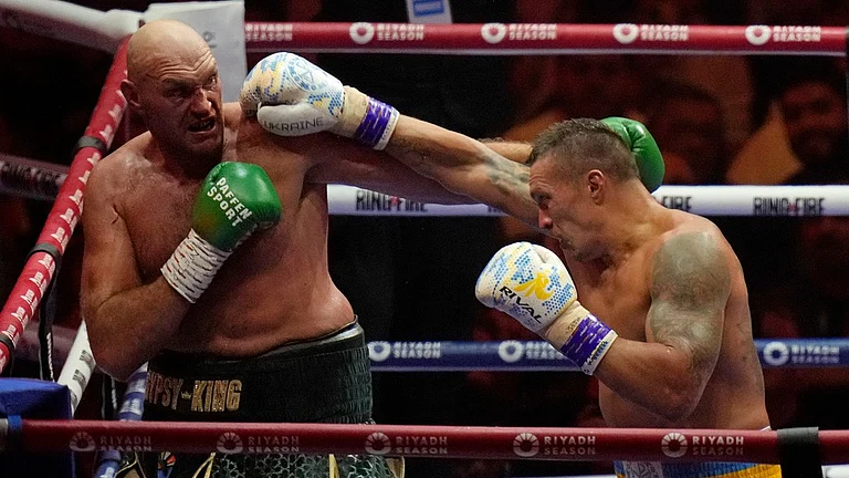 Oleksandr Usyk defeated Tyson Fury by split decision to become the first undisputed heavyweight boxing champion in 24 years. - AP/Francisco Seco