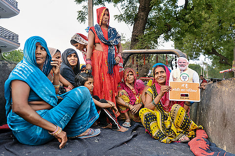 BJP supporters at an election meeting in rural Raebareli awaiting BJP candidate Dinesh Pratap Singh