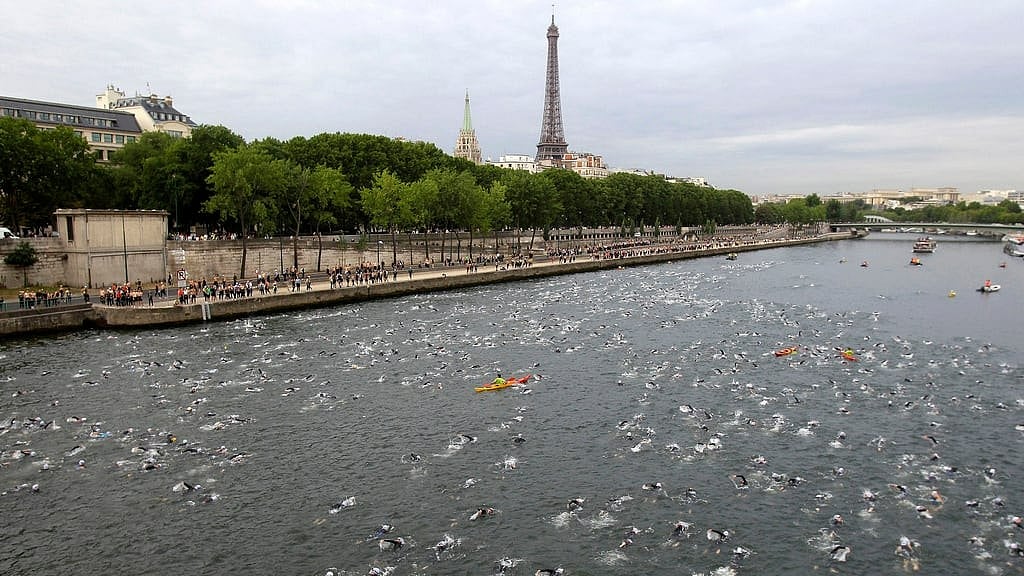 Competitors swim in the Seine River during the Paris Triathlon competition in Paris Sunday, July 10, 2011. - AP