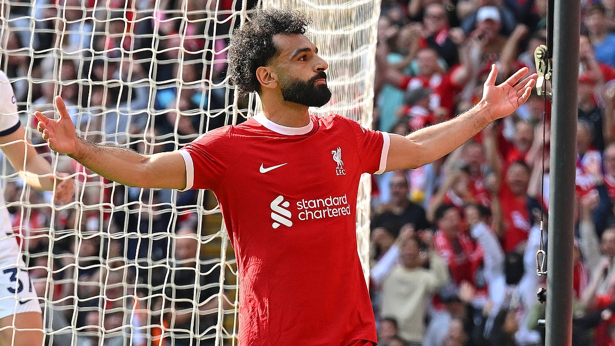 Liverpool striker Mohamed Salah celebrates his goal against Tottenham Hotspur in their English Premier League 2023-24 game at Anfield. - null
