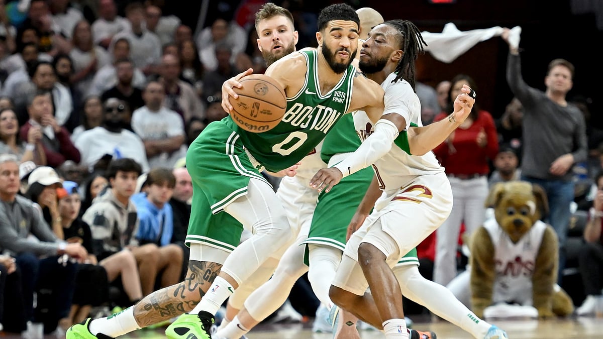 Jayson Tatum drives against Darius Garland in Game 4.