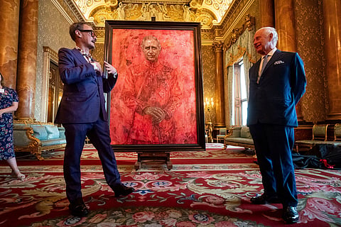 Artist Jonathan Yeo, left, and Britain's King Charles III at the unveiling of artist Yeo's portrait of the King, in the blue drawing room at Buckingham Palace, in London, Tuesday May 14, 2024. 