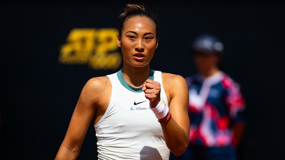 Zheng Qinwen celebrates her victory over Naomi Osaka. - null