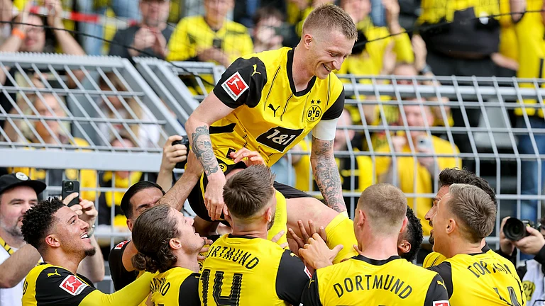 Marco Reus celebrates after scoring on his final Bundesliga outing for Borussia Dortmund. - null