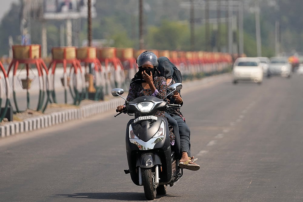 | Photo: AP/Channi Anand