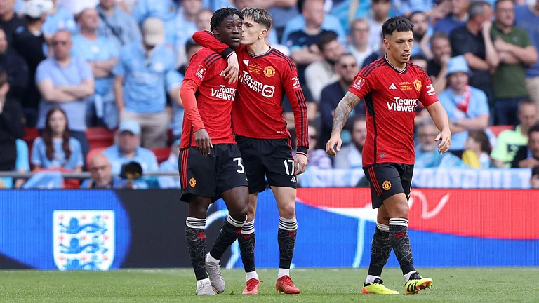 Mainoo and Garnacho celebrate United's second goal. - null